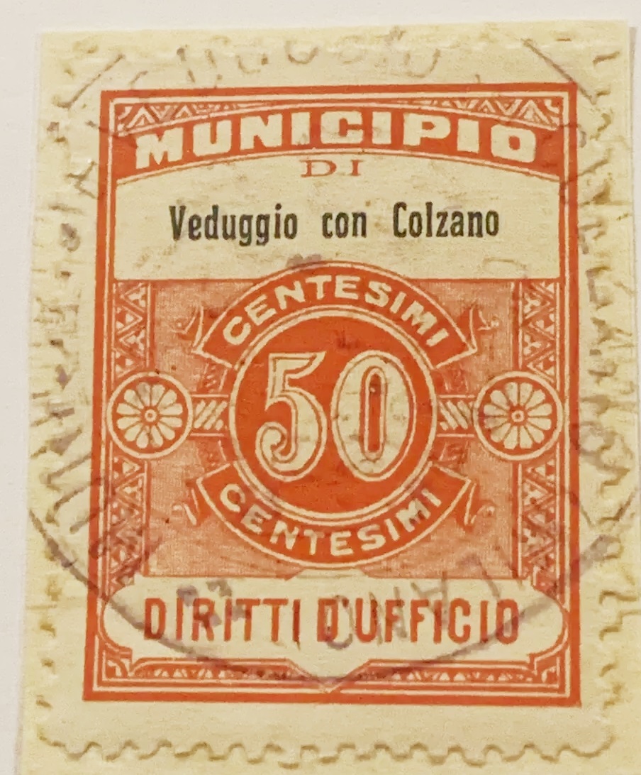 Marca da Bollo del Comune di VEDUGGIO CON COLZANO su Carta Bianca di dimensioni 17 x 21 mm